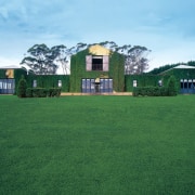 An exterior view of this classic italian villa cottage, estate, facade, farm, field, grass, grassland, green, home, house, land lot, landscape, lawn, mansion, meadow, pasture, plant, property, real estate, residential area, roof, rural area, sky, yard, green, teal