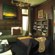 Subtly patterend wallpaper features above the libary's mahogany interior design, living room, real estate, room, brown
