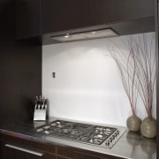 A view of the modern Smeg stainless steel architecture, cabinetry, countertop, home appliance, house, interior design, kitchen, light fixture, room, sink, under cabinet lighting, black