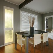 A view of this interior living space of architecture, ceiling, chair, daylighting, dining room, floor, flooring, furniture, interior design, real estate, room, table, wall, window, window covering, wood, brown, gray