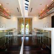 Recycled materials were used extensivley throughtout the home.The ceiling, daylighting, floor, flooring, house, interior design, table, wood, black, gray