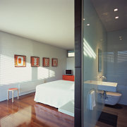 A view of the bedroom featuring  recycled architecture, ceiling, daylighting, floor, interior design, room, gray