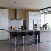 A view of the kitchen featuring two banks countertop, floor, interior design, kitchen, product design, table, gray