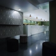 The main bar is frammed with durable CaesarStone, architecture, bathroom, ceiling, daylighting, floor, flooring, glass, house, interior design, light, lighting, lobby, room, tile, wall, black, gray