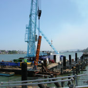 A view of the Portside Wharf  Waterway construction, crane, crane vessel floating, jackup rig, port, sea, teal