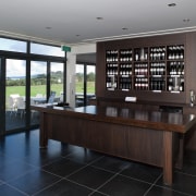 Arrangment of rooms is logica. The tasting room floor, flooring, furniture, interior design, real estate, table, black, gray
