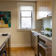 A view of the kitchen, wooden flooring and cabinetry, countertop, cuisine classique, floor, flooring, home, interior design, kitchen, real estate, room, window, brown, gray
