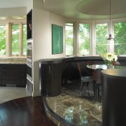 A view of the dining area, tiled floor, cabinetry, countertop, floor, flooring, home, interior design, kitchen, living room, room, window, wood flooring, black, brown