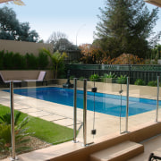 A view of a swimming pool by Cascade. backyard, fence, handrail, leisure, outdoor structure, property, real estate, residential area, swimming pool, yard, brown