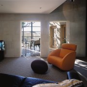 An interior view of the living areas featuring architecture, ceiling, floor, house, interior design, living room, property, real estate, room, window, gray, black
