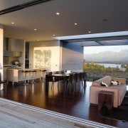 A view of the kitchen, ldining and living architecture, ceiling, daylighting, floor, flooring, house, interior design, living room, real estate, roof, table, window, black, gray