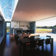 A view of the dining and lounge areas, architecture, ceiling, daylighting, dining room, house, interior design, living room, property, real estate, roof, window, black