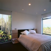 A view of a bedroom, carpet, lights, white architecture, bed, bed frame, bedroom, ceiling, daylighting, home, house, interior design, real estate, room, wall, window, gray