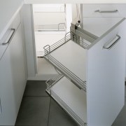 A view of this kitchen featuring cabinetry and bathroom accessory, chest of drawers, drawer, furniture, home appliance, kitchen, product, product design, tap, gray