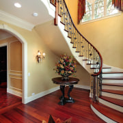 With a repeating pattern of three baluster styles ceiling, estate, floor, flooring, handrail, hardwood, home, interior design, laminate flooring, living room, lobby, real estate, room, stairs, wall, wood, wood flooring, red