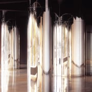 White terrazo floors contrast a matt black ceiling column, floor, flooring, interior design, light, lighting, structure, wood, black