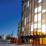 With this dramatic, diamond-shaped tower and serrated, curvilinear architecture, building, city, commercial building, condominium, corporate headquarters, daytime, downtown, facade, headquarters, metropolis, metropolitan area, mixed use, neighbourhood, real estate, reflection, residential area, sky, skyscraper, tower block, urban area, blue