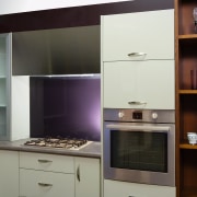 A view of this kitchen featuring a stainless cabinetry, countertop, home appliance, interior design, kitchen, room, black, gray