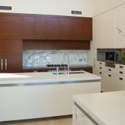 The island in this kitchen have benchtops of cabinetry, countertop, interior design, kitchen, gray