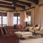 An interior view of the living area featuring ceiling, curtain, furniture, interior design, living room, property, room, window, window covering, window treatment, brown, red