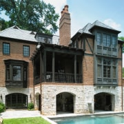 An exterior view of this traditional tudor style building, estate, facade, historic house, home, house, mansion, property, real estate, window, black, white