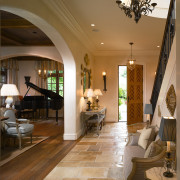 A view of this entrance hallway featuring tiled ceiling, estate, floor, flooring, hardwood, home, interior design, laminate flooring, living room, lobby, room, wood, wood flooring, brown