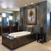 A view of the bathrooms featuring recessed bathtubs, bathroom, ceiling, floor, flooring, interior design, room, gray, black