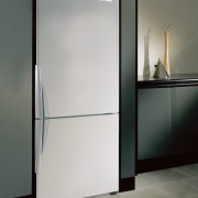 A view of this kitchen featuring the latest door, glass, product design, gray