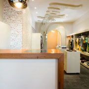 The breif called for adaptable displays and funky ceiling, furniture, home, interior design, light fixture, lighting, room, table, gray