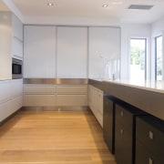 A view of this Kitchen designed by Fyfe cabinetry, ceiling, countertop, daylighting, floor, flooring, hardwood, interior design, kitchen, laminate flooring, property, real estate, room, wood, wood flooring, gray