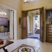 Other traditional French elements include the limestone floors ceiling, door, estate, floor, flooring, home, interior design, lobby, property, real estate, room, brown, gray