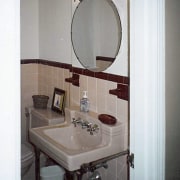 With no cabinetry, and tiling which appeared dated, bathroom, bathroom accessory, bathroom cabinet, bathroom sink, interior design, plumbing fixture, product design, room, sink, tile, toilet, toilet seat, gray, white