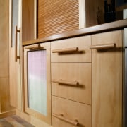 A view of a kitchen designed and manufactured cabinetry, chest of drawers, countertop, cupboard, drawer, floor, furniture, hardwood, interior design, kitchen, plywood, sideboard, wood, wood stain, brown, orange