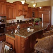 A view of some kitchen cabinetry made by cabinetry, countertop, cuisine classique, hardwood, home, interior design, kitchen, room, brown, red