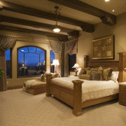 A view of the master bedroom with a bed, bedroom, ceiling, estate, furniture, home, interior design, lighting, room, suite, brown