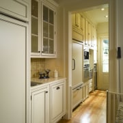 This amex contains a breakfast kitchen, also used cabinetry, countertop, cuisine classique, door, floor, flooring, hardwood, home, interior design, kitchen, room, window, wood flooring, brown, orange