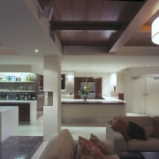 A view of the kitchen and living areas, ceiling, interior design, living room, lobby, gray, black