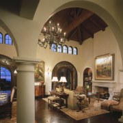 A view of the living area featuring covered arch, ceiling, estate, hacienda, home, interior design, living room, lobby, brown
