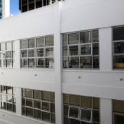 Blinds help to control light from the central architecture, building, facade, window, gray