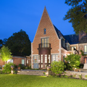 An exterior view of the patio area. - building, campus, cottage, estate, facade, farmhouse, grass, historic house, home, house, landmark, manor house, mansion, national trust for places of historic interest or natural beauty, neighbourhood, property, real estate, residential area, sky, suburb, tree, villa, brown, blue