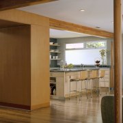 Clad in vertical grain Douglas fir panels, the cabinetry, door, floor, flooring, furniture, hardwood, interior design, wood, brown