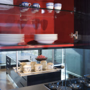 View of kitchen desihned by Architect Angela Foster display case, glass, interior design, kitchen, table, red