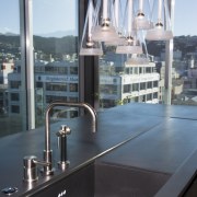 View of kitchen desihned by Architect Angela Foster glass, black