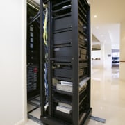 Equipment racks, built on a floor railing system, technology, white, black