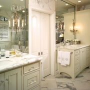 Expansive use of mirrors ensures the bathroom appears bathroom, bathroom accessory, bathroom cabinet, cabinetry, countertop, cuisine classique, home, interior design, kitchen, room, sink, white, brown