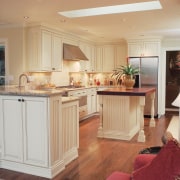 A view of a kitchen remodelled by Design cabinetry, countertop, cuisine classique, floor, flooring, furniture, hardwood, home, interior design, kitchen, living room, room, wood flooring, orange, gray