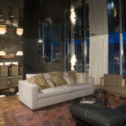 An interior view of this apartment living area furniture, interior design, lighting, living room, lobby, black