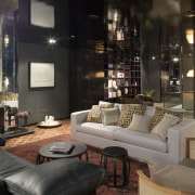 An interior view of this apartment living area home, interior design, lighting, living room, lobby, property, room, black