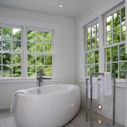 New, classic-look windows frame the views. - New, architecture, bathroom, floor, home, interior design, plumbing fixture, real estate, window, gray