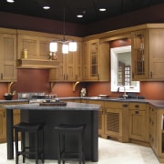 A view of the remodelled interior of this cabinetry, countertop, cuisine classique, furniture, interior design, kitchen, room, under cabinet lighting, black, brown